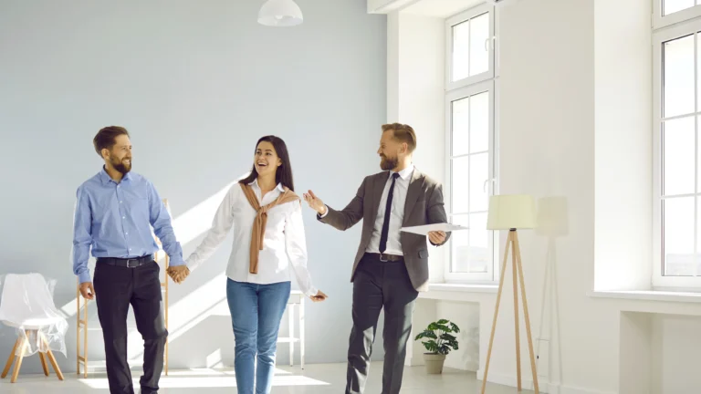A professional realtor standing in front of a house, showcasing local expertise in buying, selling, and investing like a Realtor near me