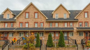 Selling a Home in Autumn - A cozy neighborhood scene featuring a home for sale surrounded by colorful fall leaves, capturing the charm and appeal of the autumn season for property transactions.