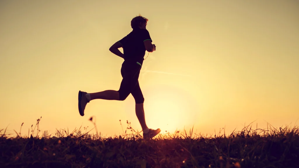 Runner participating in the Marathon of Hope, enjoying a meaningful Thanksgiving run surrounded by fall colours