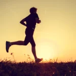 Runner participating in the Marathon of Hope, enjoying a meaningful Thanksgiving run surrounded by fall colours