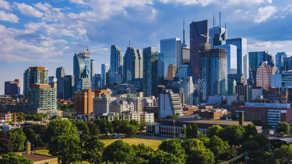 A map of Toronto highlighting its diverse neighbourhoods, including downtown, midtown, and suburban areas, showing parks, streets, and residential clusters.